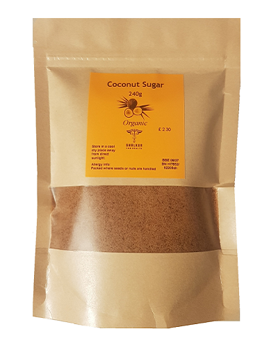 Packaged coconut sugar in a clear plastic pouch with a brown paper backing, labeled as organic.